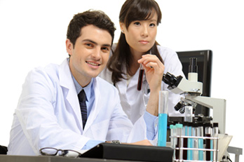 medical assistants with microscope